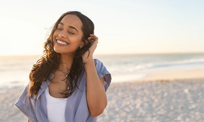 Dentist Sacramento CA Woman Smiling On Beach