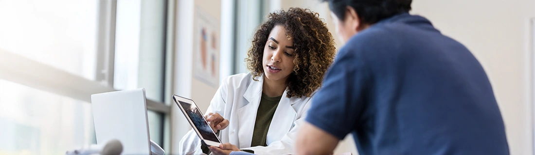 Dentist Sacramento CA Doctor Pointing To Tablet